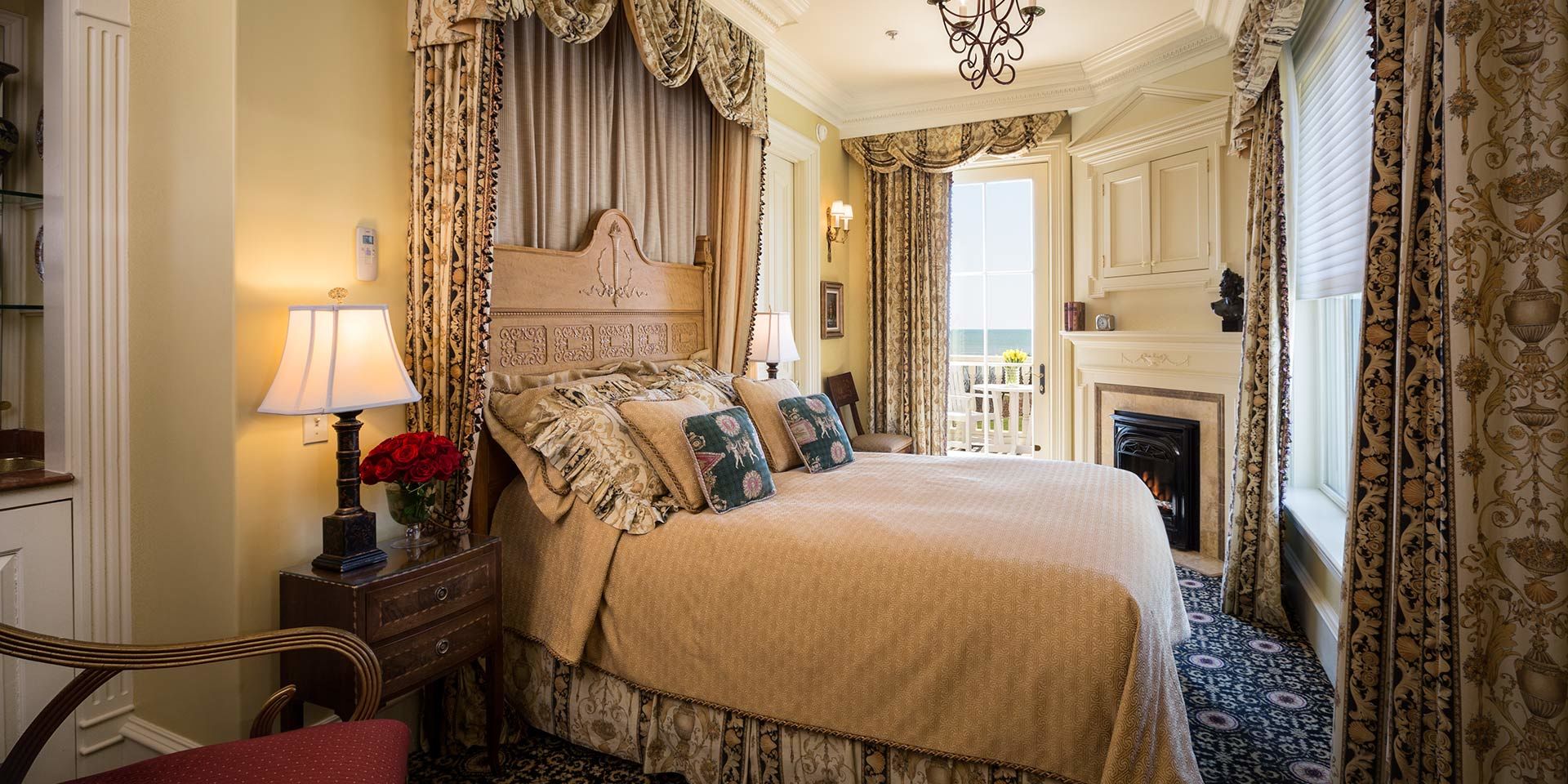 Delight in the Greek dentil molding and traditional torch designs that open up to a walkout deck with breathtaking views of the Atlantic Ocean inside the Greek Revival Guest Room 